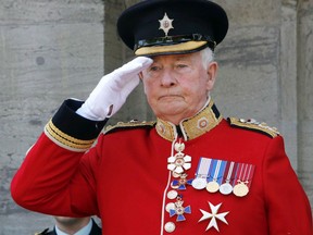 Governor General and Commander in Chief David Johnston salutes members of the Ceremonial Guard on the grounds of Rideau Hall, the official residence of the Governor General, in Ottawa, Saturday June 25, 2016. (THE CANADIAN PRESS/Fred Chartrand)