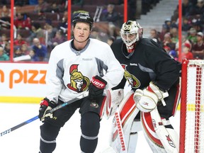 Senators forward Chris Neil and goalie Matt O'Connor at morning skate on Dec. 29. (Jean Levac, Postmedia Network)