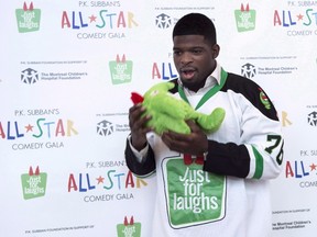 Predators defenceman P.K. Subban hams it up with a stuffed mascot during a news conference in advance of the P.K. Subban All-Star Comedy Gala in Montreal on Aug. 1, 2016. (Paul Chiasson/The Canadian Press)