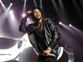 In this March 2, 2015, file photo, Trey Songz performs during the Between The Sheets Tour at Philips Arena in Atlanta. Police say Songz has been arrested for throwing microphones and speakers from the stage during a performance at Joe Louis Arena in Detroit. The Detroit Police Department says Songz, whose real name is Tremaine Neverson, was arrested Wednesday, Dec. 28, 2016, after the show. (Photo by Robb D. Cohen/Invision/AP, File)