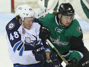 Manitoba Moose left winger Brendan Lemieux (left) and Texas Stars left winger Remi Elie tangle during a game earlier this month. (Brian Donogh/Winnipeg Sun file photo)