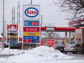 Customers come and go from an Esso station on Wellington Road in London. Gas prices are set to rise with the arrival of the New Year when the cap and trade comes into effect. (CRAIG GLOVER, The London Free Press)