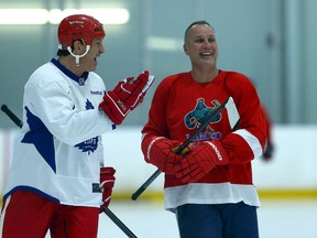 Former Red Wings Brendan Shanahan and Paul Coffey chat during practice ahead of the Centennial Classic Alumni Game in Toronto on Dec. 29, 2016. (Dave Abel/Toronto Sun/Postmedia Network)