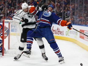 Edmonton Oilers' Eric Gryba is grabbed by L.A. Kings' Devin Setoguchi at Rogers Place on Thursday, Dec. 29, 2016. (Ian Kucerak)