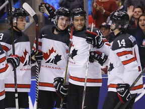 Canada's Taylor Raddysh celebrates his fourth goal of the game as Canada defeats Latvia 10-2 in world juniors action on Dec. 29, 2016. (Michael Peake/Toronto Sun/Postmedia Network)