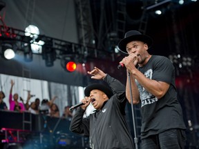 In this Sept. 2, 2012 file photo, Joseph "Run" Simmons, left, and Darryl "DMC" McDaniels of Run-DMC perform at the "Made In America" music festival in Philadelphia. The rap group Run-DMC has filed a $50 million lawsuit in New York Thursday, Dec. 29, 2016, accusing Wal-Mart, Amazon, Jet and other retailers of selling products that traded on the group's name without permission. Run-DMC was founded in New York in 1981 by Simmons, McDaniels and Jason "Jam Master Jay" Mizell. (Photo by Drew Gurian/Invision/AP, File)