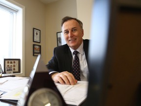MP Neil Ellis, pictured here inside his Belleville office, hinted at making three funding announcements in January.