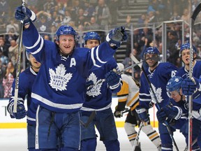 The Leafs' Morgan Rielly celebrates an overtime winning goal by teammate Jake Gardiner against the Pittsburgh Penguins during an NHL game at the Air Canada Centre on Dec. 17, 2016. (Photo by Claus Andersen/Getty Images)