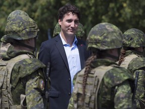 Prime Minister Justin Trudeau reviews an honour guard as they arrive at the International Peacekeeping and Security Centre in Yavoriv, Ukraine, in this July 12, 2016 file photo. (THE CANADIAN PRESS/Adrian Wyld)