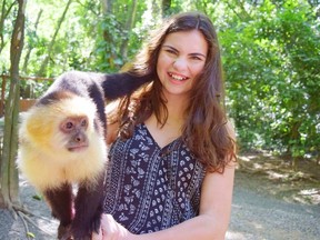Reporter Steve MacNaull's 14-year-old daughter, Grace, bonds with Poncha during an excursion to the Gumbalimba Preserve in Roatan, Honduras, from the Norwegian Getaway cruise ship. STEVE MACNAULL PHOTO