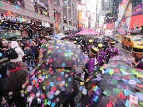 Times Square Alliance and Countdown Entertainment, co-organizers of Times Square New Years Eve, along with presenting sponsor, Planet Fitness test the air worthiness of the New Years Eve confetti from the Hard Rock Cafe marquee on December 29, 2016 in New York City. (Photo by Neilson Barnard/Getty Images)