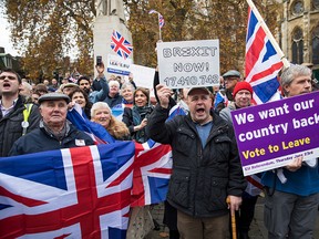 Pro-Brexit demonstrators protest outside the Houses of Parliament on November 23, 2016 in London, England. British Prime Minister Theresa May has said that she will not delay triggering article 50, the formal process of leaving the European Union, but wants to avoid a 'cliff edge'. (Photo by Jack Taylor/Getty Images)