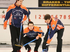 Skip Tanner Horgan representing the Copper Cliff Curling Club watches his shot as team mates Jacob Horgan and Maxime Blais get set to sweep during the championship round of the the Northern Ontario U21 Men's provincial play downs against the Warkentin rink representing the Community First Curling Club from Sault Ste Marie at the Sudbury Curling Club  in Sudbury, Ont. on Friday December 30, 2016. The Horgan rink defeated the Warkentin rink and will represent Northern Ontario at the 2017 U21 Canadian Championships in Victoria, British Columbia next month. Gino Donato/Sudbury Star/Postmedia Network