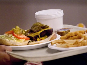 Starting Jan. 1, all chain restaurants with 20 or more locations will be required to post calorie counts on menus for each food item. (THE CANADIAN PRESS)