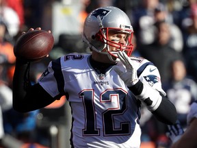 In a Sunday, Dec. 18, 2016 file photo, New England Patriots quarterback Tom Brady passes against the Denver Broncos during the first half of an NFL football game, in Denver. With a victory Sunday, Jan. 1, 2017, at Miami, the Patriots would improve to 8-0 in away games and clinch postseason home-field advantage.(AP Photo/Jack Dempsey, File)