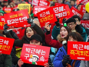 Protesters attend a rally calling for the immediate removal of South Korea's impeached President Park Geun-Hye in downtown Seoul on December 24, 2016. (Jung Yeon-Je/AFP/Getty Images)