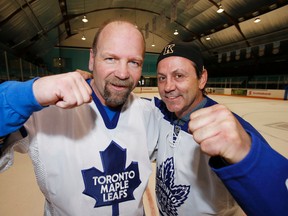 Former Maple Leafs forwards Wendel Clark and Doug Gilmour pose for a picture at St. Michael's Arena in Toronto on April 25, 2013. (Craig Robertson/Toronto Sun/Files)