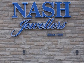 Police investigate a robbery at Nash Jewellers earlier this week. It was the second robbery in two weeks at the store at Oxford Street and Wonderland Road in London. (CRAIG GLOVER, The London Free Press)