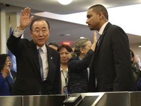 United Nations Secretary-General Ban Ki-moon waves to his staff on his last day at the U.N. headquarters, Friday, Dec. 30, 2016. (AP Photo/Mary Altaffer)