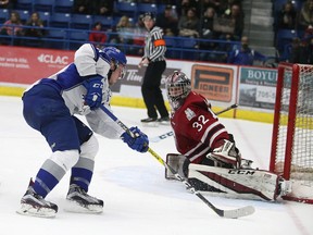 Sudbury Wolves Dmitry Sokolov tries to get a shot on Guelph Storm goalie Anthony Popovich during OHL action in Sudbury, Ont. on Friday December 30, 2016. Gino Donato/Sudbury Star/Postmedia Network