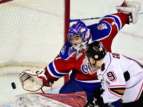 Calgary Hitmen's Andrei Grishakov scored the game-tying goal on Edmonton Oil Kings goalie Patrick Dea at the Saddledome in the first of a home and away series on Friday, Dec. 30. (Ryan McLeod)