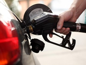 A gas station attendant pumps fuel into a car in this file photo. (Sean Gallup/Getty Images)