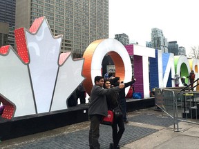 Nathan Phillips Square was abuzz on the last day of 2016 as people went for a last skate before the New Year — and to pose with the new maple leaf shining at the end of the iconic Toronto sign.
The addition commemorates Canada’s 150th birthday in 2017. 
“The Toronto Sign has a new addition for #Canada150! The ‘TO Canada with Love’ 3D Leaf is here just in time to kick off #C150TO celebrations!” tweeted Mayor John Tory.