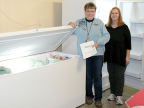 CHRIS ABBOTT/TILLSONBURG NEWS
The Helping Hand Food Bank recently received a $2,500 grant, which they used to purchase two new freezers for meat. With the two new units are Joan Clarkson, coordinator, (on the left) and Val Foerster, who helped with the grant application.