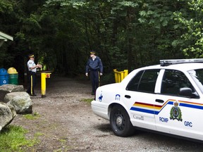 Police investigate in Pacific Spirit Park  in Vancouver, B.C. (Postmedia Network)