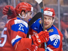 Team Russia's Yakov Trenin (left) celebrates scoring his team's second goal against Team Slovakia with Kirill Urakov during third period world junior hockey championship action in Toronto on Saturday, Dec. 31, 2016. (Chris Young/The Canadian Press)