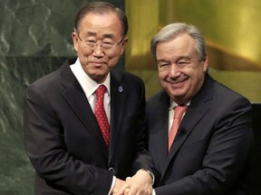 United Nations Secretary-General Ban Ki-moon, left, clasps hands with U.N. Secretary-General designate Antonio Guterres after Guterres was sworn in at U.N. headquarters. (AP Photo/Seth Wenig, File)