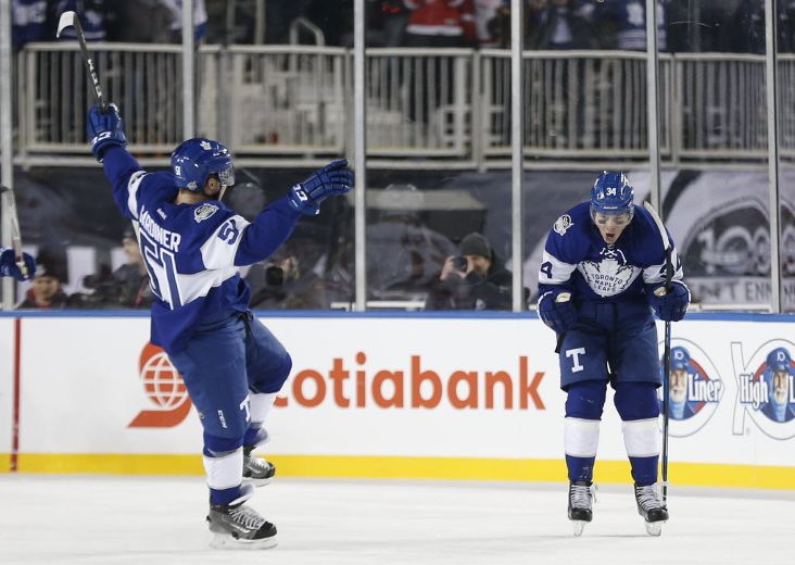 January 01, 2017: Toronto Maple Leafs left wing Matt Martin (15) fights  Detroit Red Wings center Steve Ott (29) along the benches during the 2017  Scotiabank NHL Centennial Classic between The Toronto