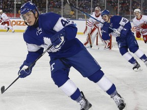 Toronto Maple Leafs Morgan Rielly and Mitch Marner start the back check during the third period at the Centennial Classic in Toronto on Sunday January 1, 2017. (Jack Boland/Toronto Sun/Postmedia Network)