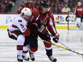 Ottawa Senators' Cody Ceci pressures Washington Capitals center Nicklas Backstrom, of Sweden, during the second period of an NHL hockey game, Sunday, Jan. 1, 2017, in Washington. (AP Photo/Molly Riley)