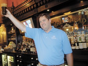 In this Aug. 1, 2008 photo, Dublin Irish Festival honorary chairman John T. Fleming proposes a toast following the tapping of the first Dublin Stout Keg at Brazenhead in Dublin, Ohio. A flight-tracking service shows that a plane piloted by the Ohio executive with five other people onboard quickly lost altitude after taking off from Cleveland's lakeshore airport. The parents of Superior Beverage Company executive John T. Fleming confirmed he was piloting the Columbus-bound plane when it vanished late Thursday, Dec. 29, 2016, over Lake Erie. (ThisWeek Newspapers/The Columbus Dispatch via AP)