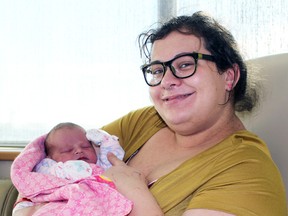Elizabeth Dafoe holds her newborn baby, Jasmine Noelle Marie, at Bluewater Health on Monday, Jan. 2, 2017 in Sarnia, Ont. Jasmine, born at 12:16 p.m. Sunday, was the first Sarnia baby of the year. (Terry Bridge/Sarnia Observer/Postmedia Network)