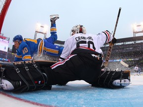 Corey Crawford of the Chicago Blackhawks makes a save against Scottie Upshall of the St. Louis Blues during the Winter Classic at Busch Stadium on Jan. 2, 2017. (Dilip Vishwanat/Getty Images)