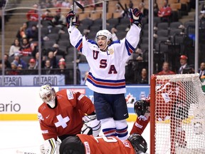 Team USA's Luke Kunin celebrates his goal past Switzerland goaltender Joren van Pottelberghe durin  IIHF World Junior Championship action in Toronto on Jan. 2, 2017. (THE CANADIAN PRESS/Frank Gunn)