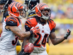 In this Sept. 18, 2016, file photo, Cincinnati Bengals cornerback Adam Jones (24) is restrained by a teammate during an NFL game against the Pittsburgh Steelers, in Pittsburgh. (AP Photo/Doug Kapustin, File)