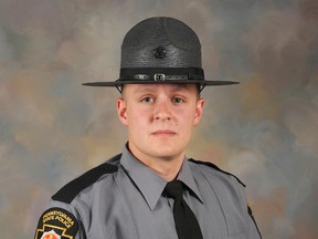 This undated photo provided by the Pennsylvania State Police shows Trooper Landon Weaver, who was killed responding to a domestic complaint Friday evening, Dec. 30, 2016, in a rural area in Huntingdon County, Pennsylvania. (Pennsylvania State Police via AP)