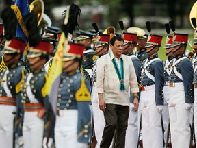 Philippine President Rodrigo Duterte inspects troops during the 81st anniversary of the Armed Forces of the Philippines at Camp Aguinaldo military headquarters in Quezon city, north of Manila, Philippines on Wednesday, Dec. 21, 2016.