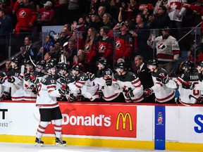 Julien Gauthier #12 of Team Canada celebrates a third period goal with teammates on the bench during the 2017 IIHF World Junior Championship quarterfinal game against Team Czech Republic at the Bell Centre on January 2, 2017 in Montreal, Quebec, Canada. Team Canada defeated Team Czech Republic 5-3. (Photo by Minas Panagiotakis/Getty Images)