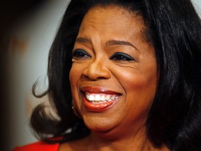 Oprah Winfrey works the red carpet before her Lifeclass show in Toronto at the Metro Convention Centre. (Craig Robertson/Toronto Sun/QMI Agency)