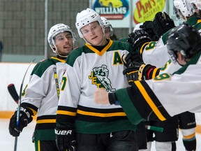 Jordan Howe, centre, Zach Maciel, left, and Cody Jodoin, following, accept fist bumps from the players on the bench as they celebrate Howe's goal that put the Jets ahead of the Port Hope Panthers 3-1 in the second period of their Provincial Junior Hockey League game Monday afternoon in Amherstview. The Panthers, however, rebounded to win the game, 6-3. (The Whig-Standard)
