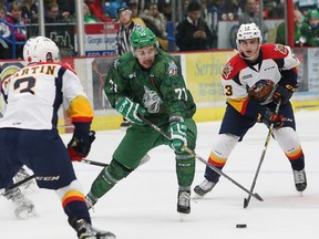 David Levin of the Sudbury Wolves slips between Erie Otters Ryan Martin, left, and Brett Neumann during OHL action in Sudbury on Nov. 11, 2016. Neumann, 17, was acquired by the Kingston Frontenacs on Monday. (John Lappa, Postmedia Network)