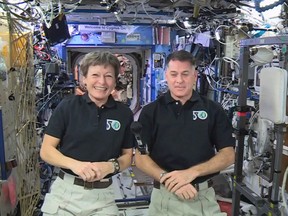 In this image made from video provided by NASA, U.S. astronauts Peggy Whitson, left, and Shane Kimbrough speak from the International Space Station during an interview on Tuesday, Jan. 3, 2017. The two are scheduled to perform spacewalks to replace batteries for the station on Friday and the following week. (NASA via AP)