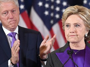 U.S. Democratic presidential candidate Hillary Clinton makes a concession speech after being defeated by Republican President-elect Donald Trump, as former President Bill Clinton looks on in New York on Nov. 9, 2016.  (JEWEL SAMAD/AFP/Getty Images)
