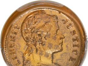 This undated photo provided by Heritage Auctions shows a glass U.S. penny. The rare coin was manufactured as a possible alternative to copper during the Second World War. The coin is expected to be auctioned in Fort Lauderdale, Fla., Thursday, Jan. 5, 2017. (Matt Poppolo/Heritage Auctions via AP)