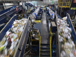 Residential recycling material being sorted at the Materials Recycling Facility as the city collects more than twice the amount of recycling and waste in the two weeks after Christmas then is typical for the rest of January and February combined in Edmonton, Tuesday, January 3, 2017. Ed Kaiser/Postmedia