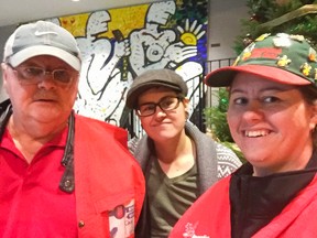 The McKay family, Colin, Mel and Julia, volunteering with Operation Red Nose Kingston in December 2015.